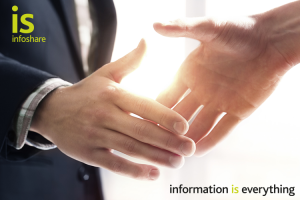 Image of two business people shaking hands to depict a partnership
